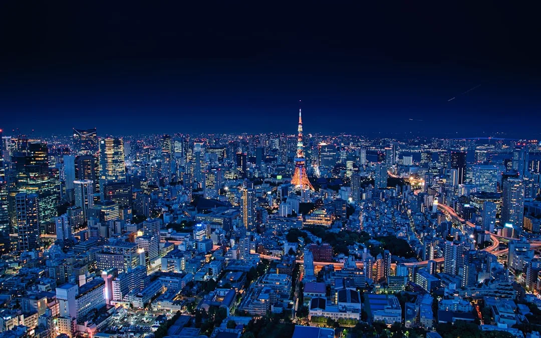 Evening JPN 4D draw schedule - Tokyo skyline at night with neon advertising, daily 17:20 WIB