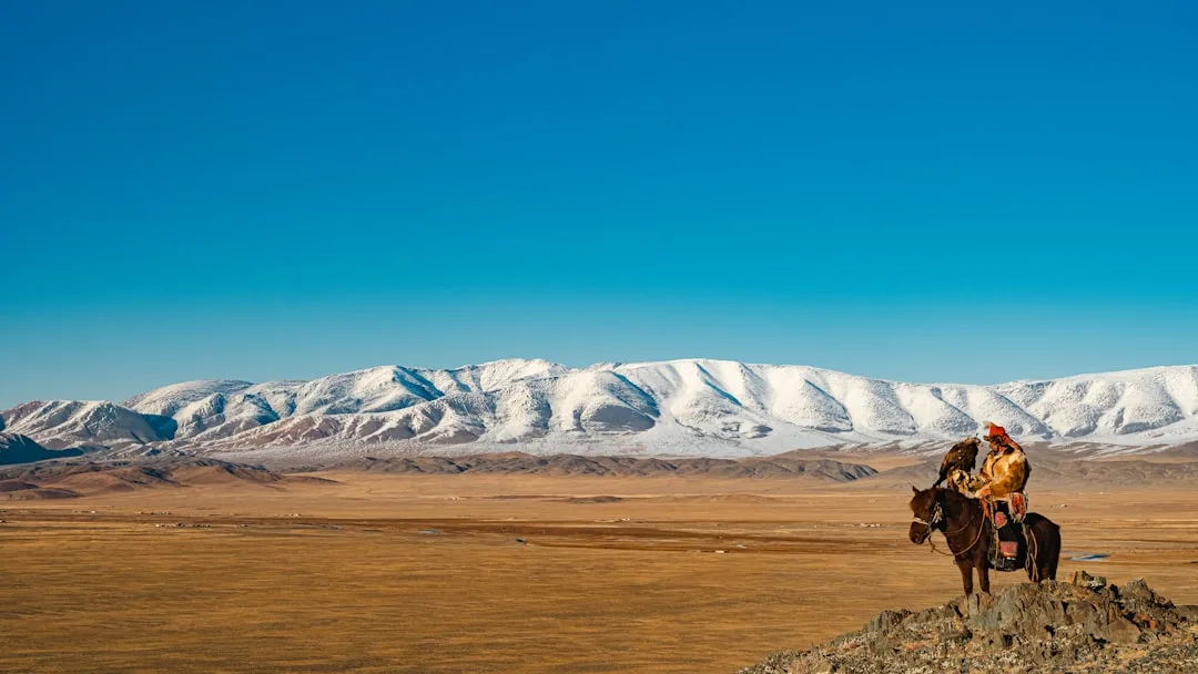 Mongolia in the togel community - horse rider on the snowy plains of Mongolia
