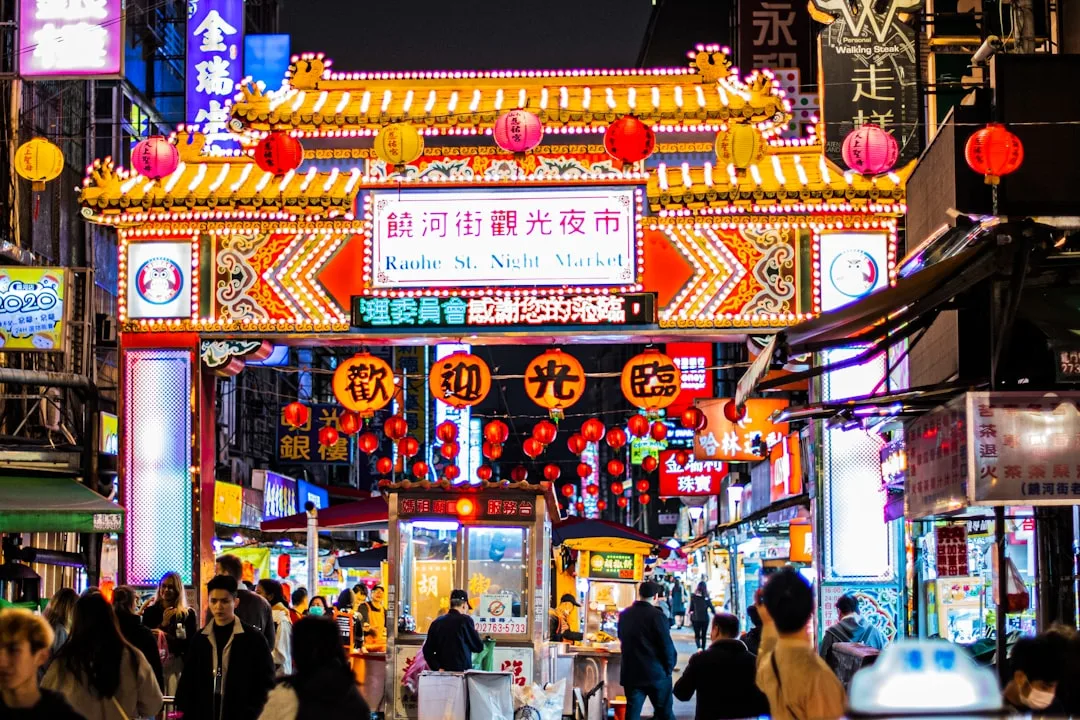 TWN 4D night live draw schedule - neon lights at a Taipei night market, daily at 20:55 WIB